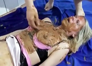 Three people are in the bathroom for a scat party