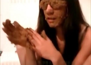 Covering her sunglasses with poop in the tub