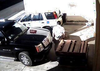 The camera caught the woman behind the car